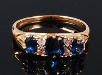 Lot 1286 - An 18ct gold, sapphire and diamond ring,...