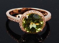 Lot 1298 - A 14ct gold, peridot and diamond ring, the...