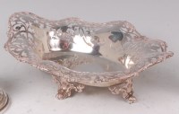 Lot 1129 - A George V silver basket, of shaped and...
