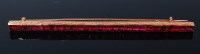 Lot 1301 - An Art Deco ruby set bar brooch, arranged as...