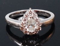 Lot 1305 - A modern 18ct white gold and diamond ring, the...