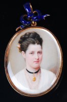 Lot 1309 - A late Victorian yellow metal mounted portrait...
