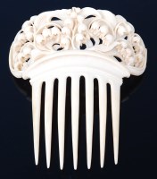 Lot 1348 - A late 19th century ivory comb, carved with...