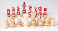 Lot 1357 - A Victorian carved ivory chess set, one side...