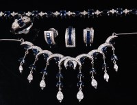 Lot 1181 - A contemporary 14ct white gold, sapphire and...