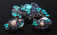 Lot 1216 - An 18ct white gold, sapphire and turquoise set...