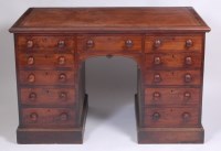 Lot 1495 - A 19th century mahogany kneehole desk in the...
