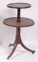 Lot 1517 - A George III mahogany two-tier dumb waiter,...
