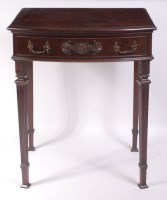 Lot 1519 - An Edwardian mahogany bowfront servery, having...