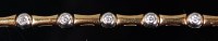 Lot 1228 - An 18ct gold diamond set bracelet, arranged as...