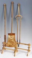 Lot 138 - A pair of turned brass fire dogs in the manner...