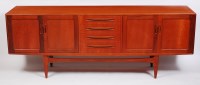 Lot 270 - A 1960s G-Plan teak long sideboard, having...