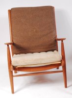 Lot 224 - A 1960s teak framed open armchair, having...