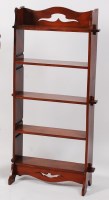 Lot 273 - A late Arts & Crafts oak freestanding open...