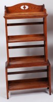 Lot 275 - An Arts & Crafts oak four tier open bookshelf,...