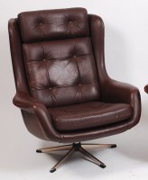 Lot 286 - A 1960s Danish chocolate brown leather button...