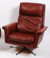 Lot 287 - A 1960s Danish tan leather swivel armchair,...
