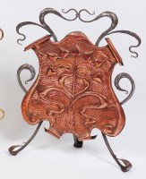 Lot 228 - A French Art Nouveau steel and embossed copper...