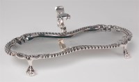 Lot 1102 - An early George III silver snuffer stand,...