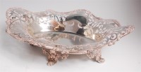 Lot 1149 - A George V silver basket, of shaped and...