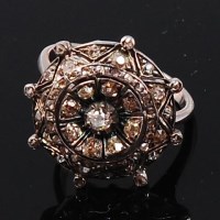 Lot 1175 - A circa 1900 white metal and diamond cluster...