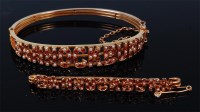 Lot 1186 - A 15ct gold, ruby and seed pearl set hinged...