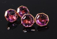 Lot 1194 - A pair of gents yellow metal and amethyst set...