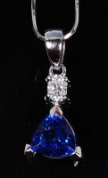 Lot 1222 - A contemporary platinum, tanzanite and diamond...