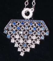 Lot 1273 - An 18ct white gold, sapphire and diamond set...