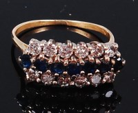Lot 1200 - A yellow metal, sapphire and diamond dress...