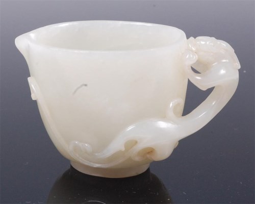 Lot 1402 - A Chinese carved pale celadon jade dragon cup,...