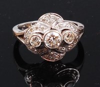 Lot 1285 - An 18ct white gold and diamond dress ring, the...