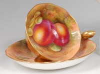 Lot 687 - A Royal Worcester porcelain teacup and saucer,...