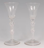 Lot 705 - A pair of mid-18th century pedestal wine...