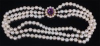 Lot 749 - A cultured pearl triple string choker, having...