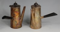 Lot 712 - A pair of George V silver chocolate pots, each...