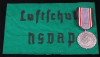 Lot 331 - A German Luftshuntz Merit medal, together with...