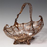 Lot 102 - A George V silver swing handled basket, of...