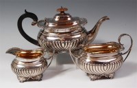 Lot 103 - A George V silver three piece teaset,...