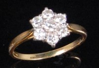 Lot 179 - An 18ct gold platinum and diamond set cluster...