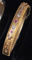 Lot 205 - An Edwardian 9ct gold ruby and diamond set...