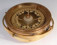 Lot 295 - A brass ships compass, the dial in case signed...