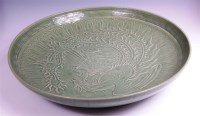 Lot 320 - A Chinese celadon ware footed charger, of good...