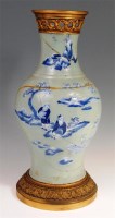 Lot 330 - A Chinese celadon baluster form vase,...