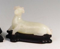 Lot 349 - A Chinese mutton jade figure of a recumbent...
