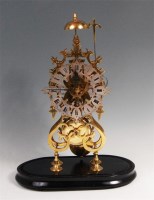 Lot 429 - A Victorian brass skeleton clock, having...