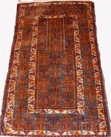 Lot 460 - A Persian woollen prayer rug, having stylised...