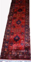Lot 464 - A Persian woollen hall runner, having an...
