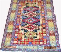 Lot 465 - A Kurdish woollen rug, having a radiating...