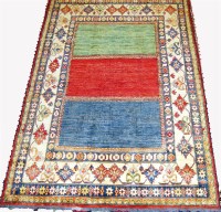 Lot 466 - A Persian woollen Kazak rug, the triple plain...